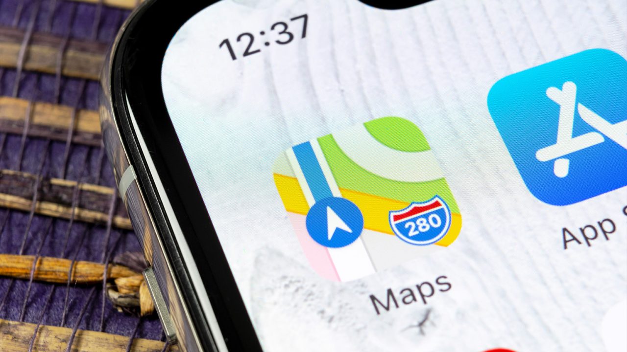 Mobile screen showing map and app icons.