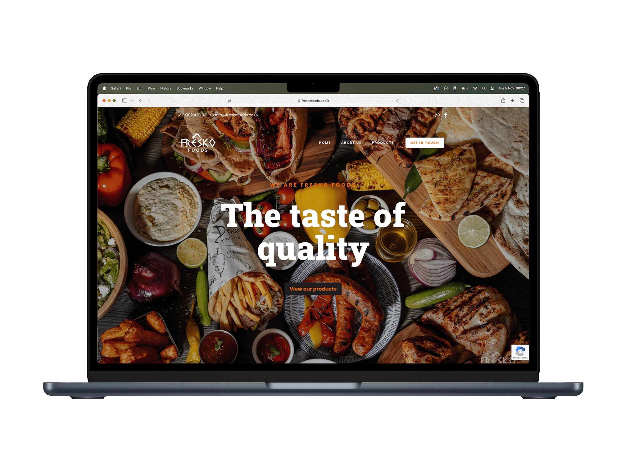 Laptop displaying website with diverse food dishes.