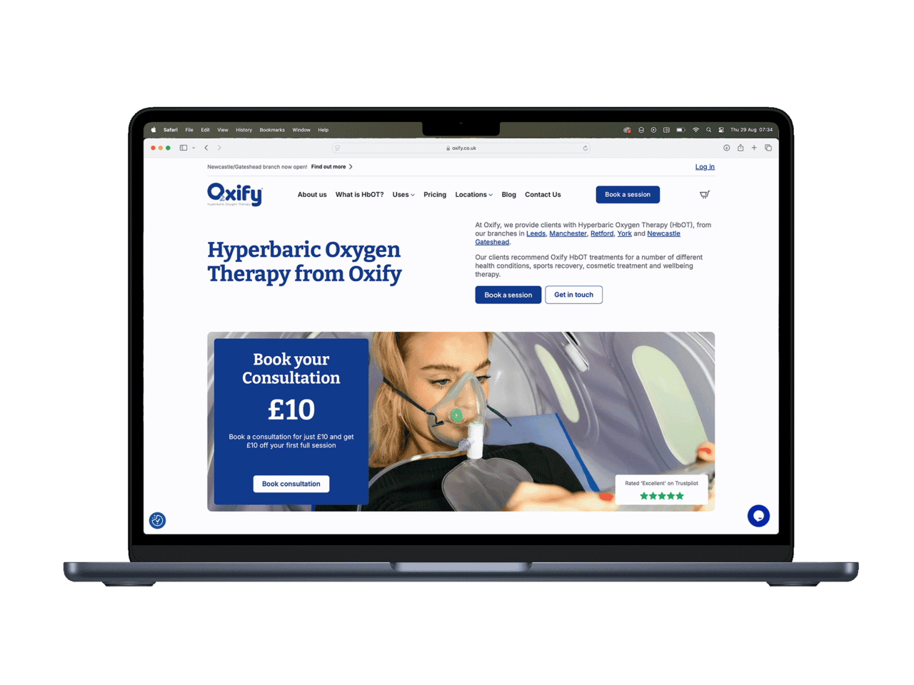 Oxify Hyperbaric Oxygen Therapy website on laptop screen.
