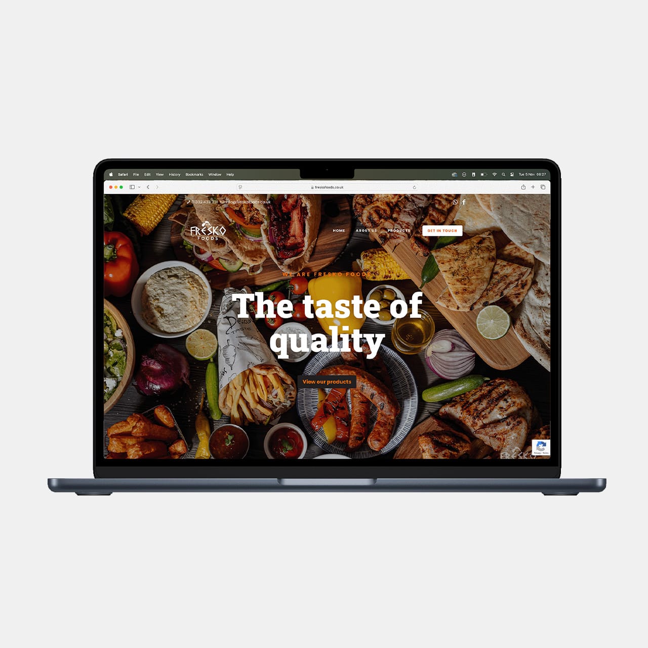 Laptop displaying gourmet food website homepage